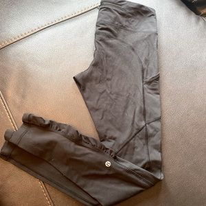Lululemon black running legging, with subtle ruffle around ankles part